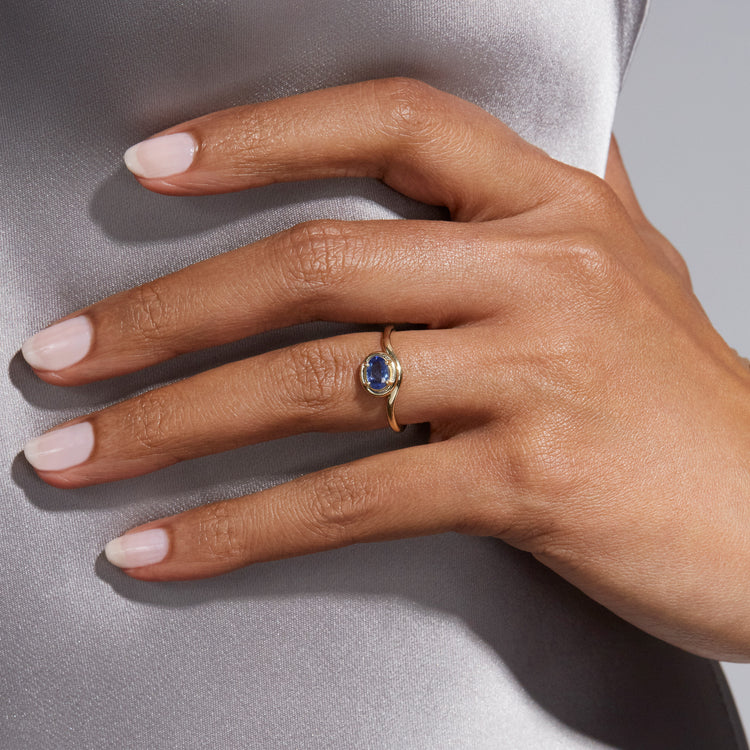 Image of 10K Yellow Gold Blue Sapphire Bonbon Merge Ring on Models Hand