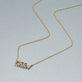 Stone and Strand 14K Yellow Gold Say My Name Diamond Necklace Editorial Image