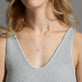 Image of 14K Yellow Gold Say My Name Diamond Necklace on Models Neck