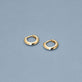 Stone and Strand 14K Yellow Gold Second Hole Gold Knife Edge Single Huggie Editorial Image