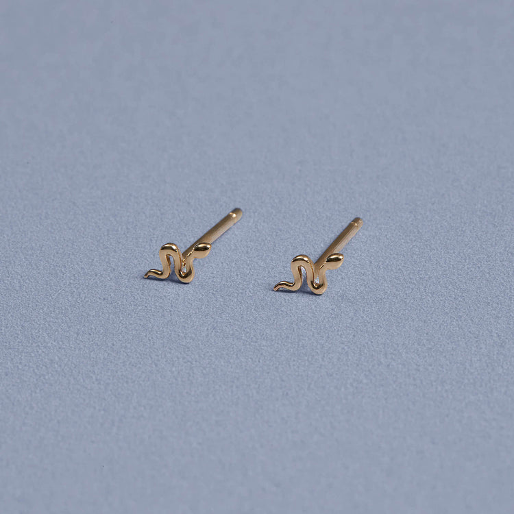 Stone and Strand 14K Yellow Gold Second Hole Gold Snake Studs Editorial Image