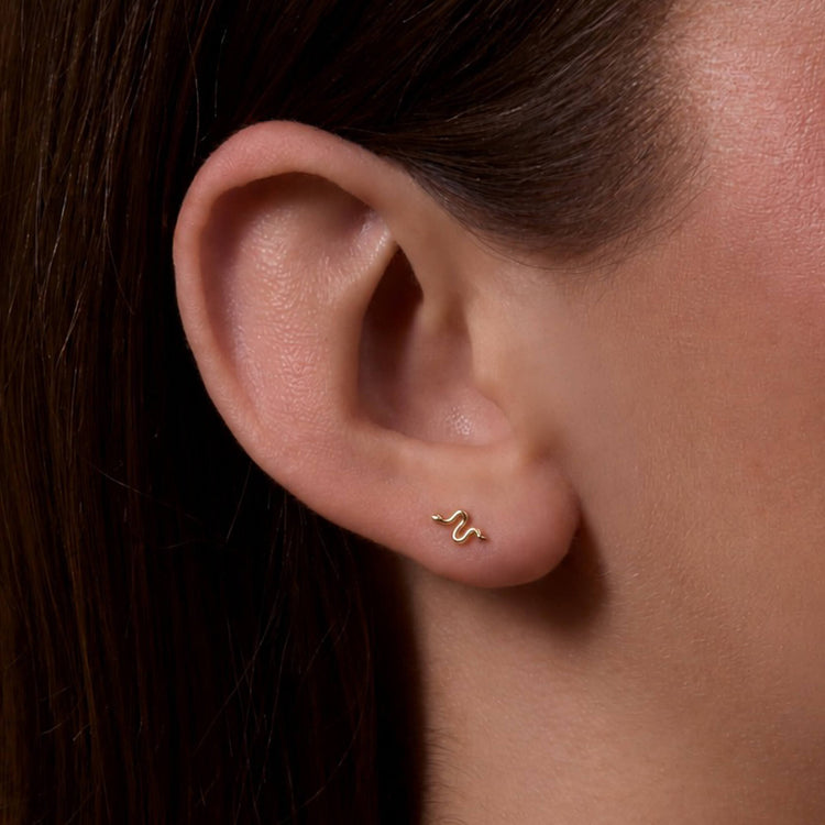Image of 14K Yellow Gold Second Hole Gold Snake Studs on Models Ear