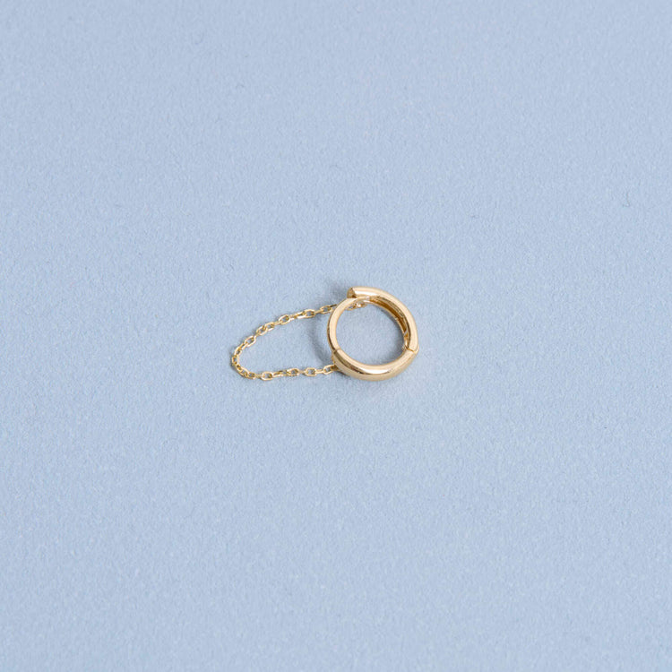 Stone and Strand 14K Yellow Gold Second Hole Mini Chain Reaction Huggie Editorial Image