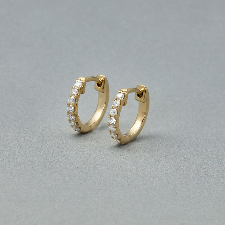 Stone and Strand 14K Yellow Gold Second Hole Diamond Pave Huggies Editorial Image