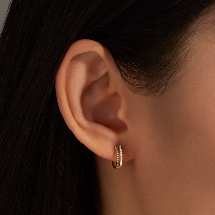 Image of 10K Yellow Gold Second Hole Velvet Rope Pave Huggies on Models Ear