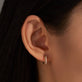 Image of 10K Yellow Gold Second Hole Velvet Rope Pave Huggies on Models Ear