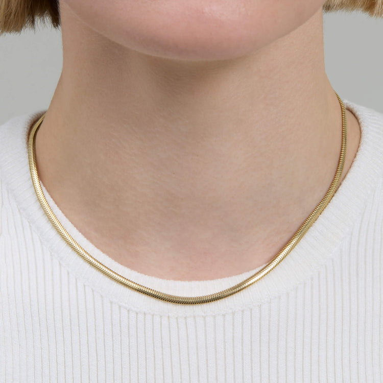 Image of 14K Yellow Gold Serpentine Necklace on Models Neck