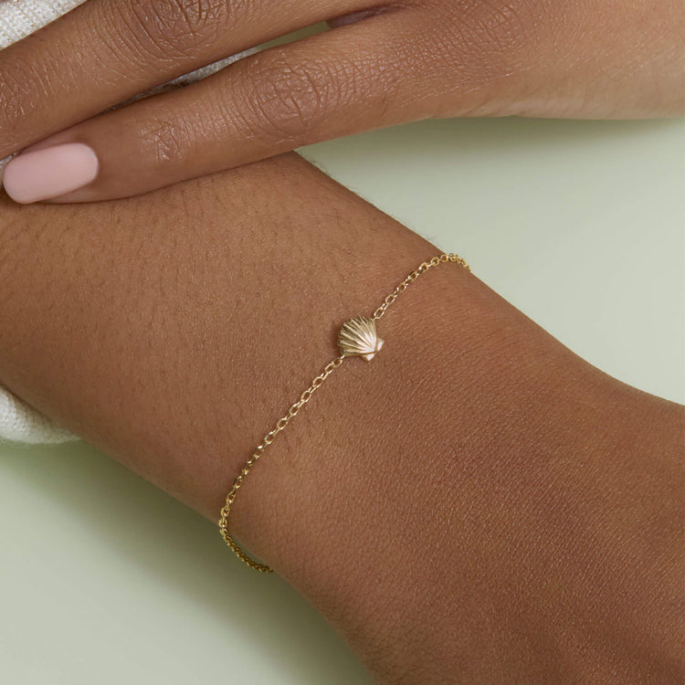 Image of 10K Yellow Gold Shell Bracelet on Models Arm