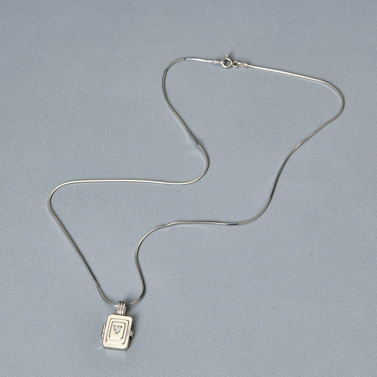 Stone and Strand Sterling Silver Beekman Heart Locket Necklace Editorial Image