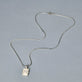 Stone and Strand Sterling Silver Beekman Heart Locket Necklace Editorial Image