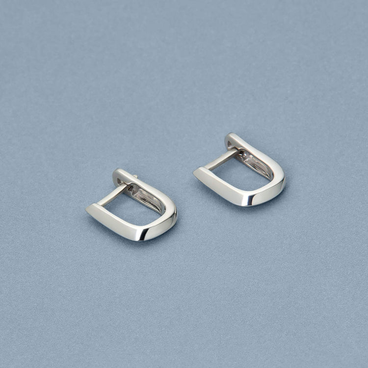 Stone and Strand Sterling Silver Knife Edge Single Hoop Editorial Image