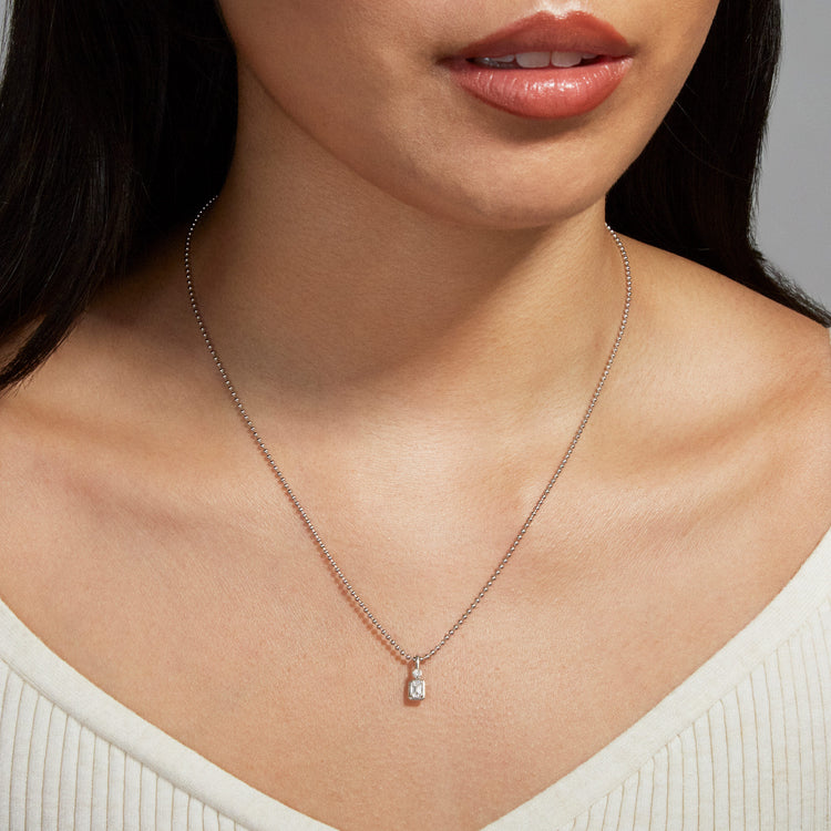 Image of Sterling Silver Silver Lab-Created Emerald Diamond Bonbon Charm on Models Neck