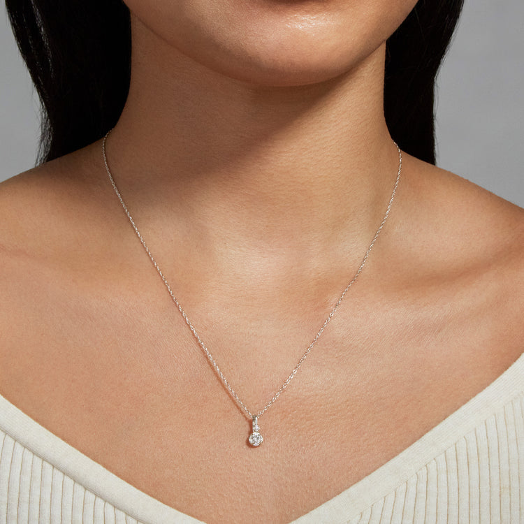 Image of Sterling Silver Silver Lab-Created Round Diamond Bonbon Charm on Models Neck