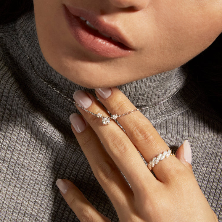 Image of Sterling Silver Fairy Lights Lab-Created Trio Diamond Necklace on Models Hand