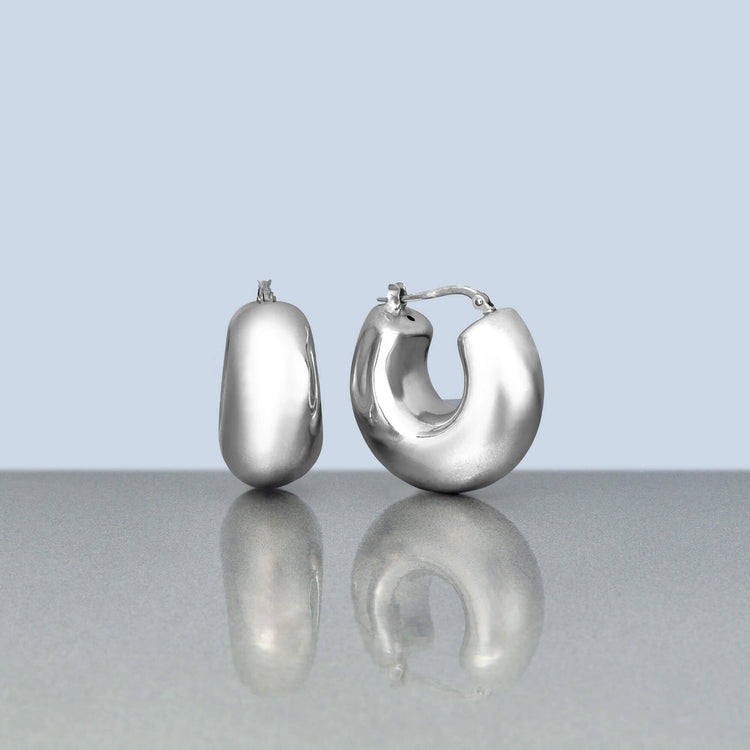 Stone and Strand Sterling Silver Silver Puff Hoops Editorial Image