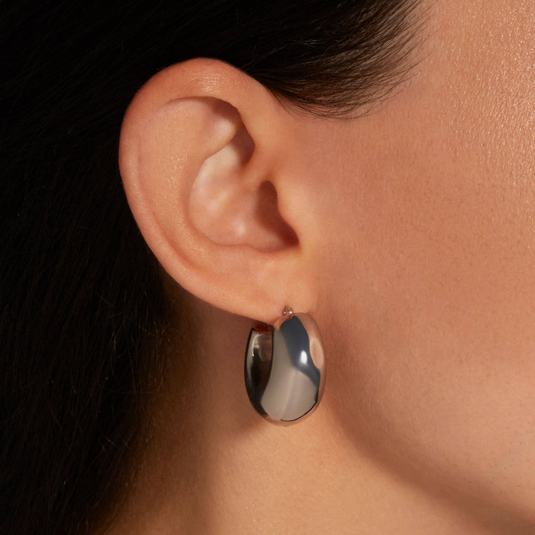 Image of Sterling Silver Silver Puff Hoops on Models Ear