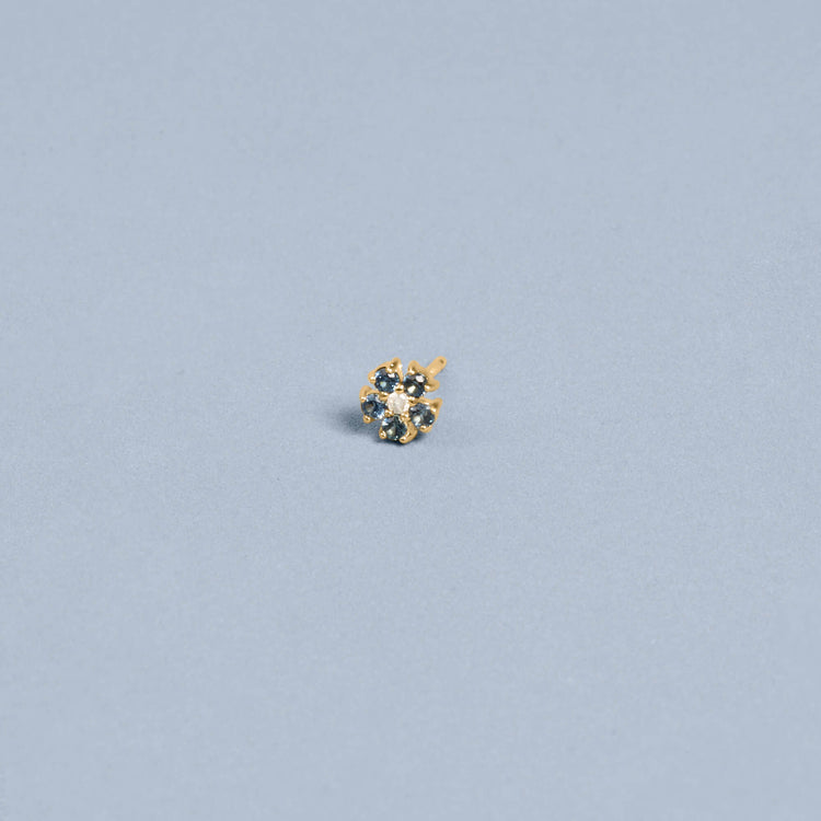 Stone and Strand 10K Yellow Gold Small Blue Sapphire and Diamond Flower Stud Editorial Image