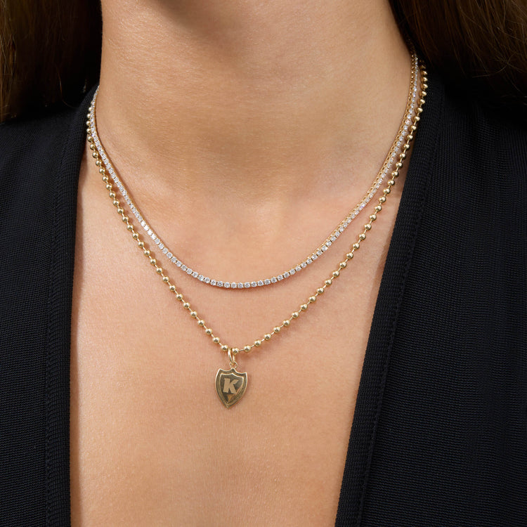 Image of 14K Yellow Gold Small Gold Initial Crest Charm with Stone and Strand Necklaces