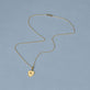 Stone and Strand 14K Yellow Gold Small Gold Initial Crest Necklace Editorial Image