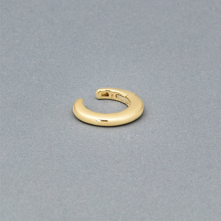 Stone and Strand 14K Yellow Gold Small Puff Ear Cuff Editorial Image