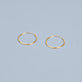 Stone and Strand 10K Yellow Gold Small Round Endless Hoop Earrings Editorial Image