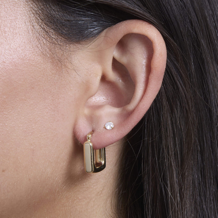 Model wearing Square Second Hole Huggies with solid gold Stone and Strand jewelry