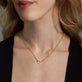 Image of 10K Yellow Gold Star Pop Lock on Models Neck