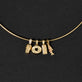 Still life image of Cream Cheese Brunch Charm with Stone and Strand solid gold jewelry