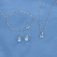Still life image of Cushion Cut Aquamarine and Pearl Drop Earrings with Stone and Strand solid gold jewelry
