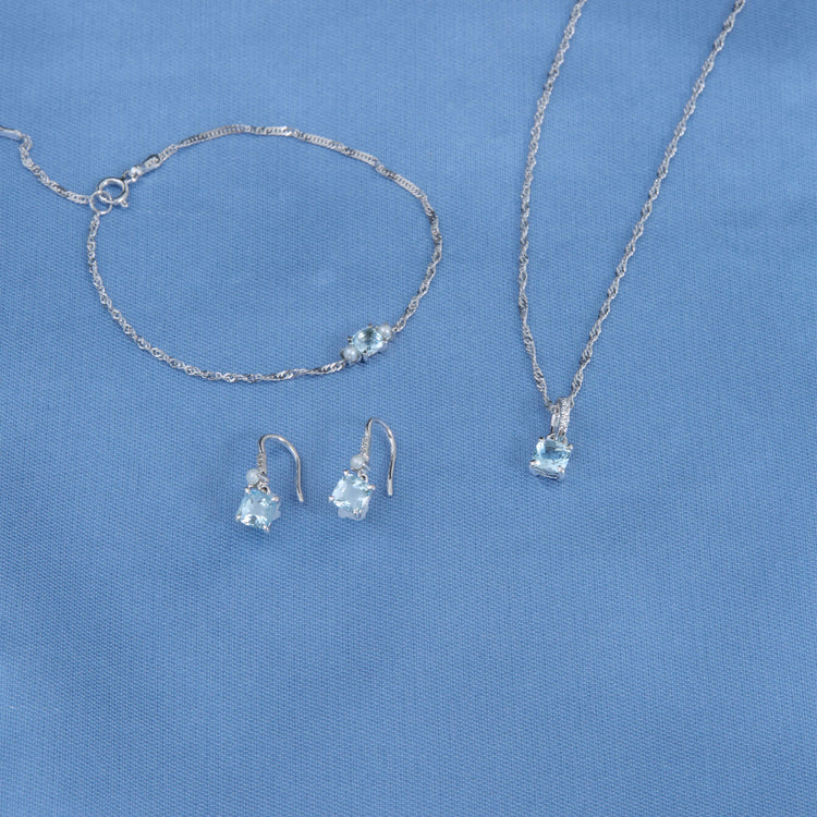 Still life image of Delicate Aquamarine Cushion Bracelet with Stone and Strand solid gold jewelry