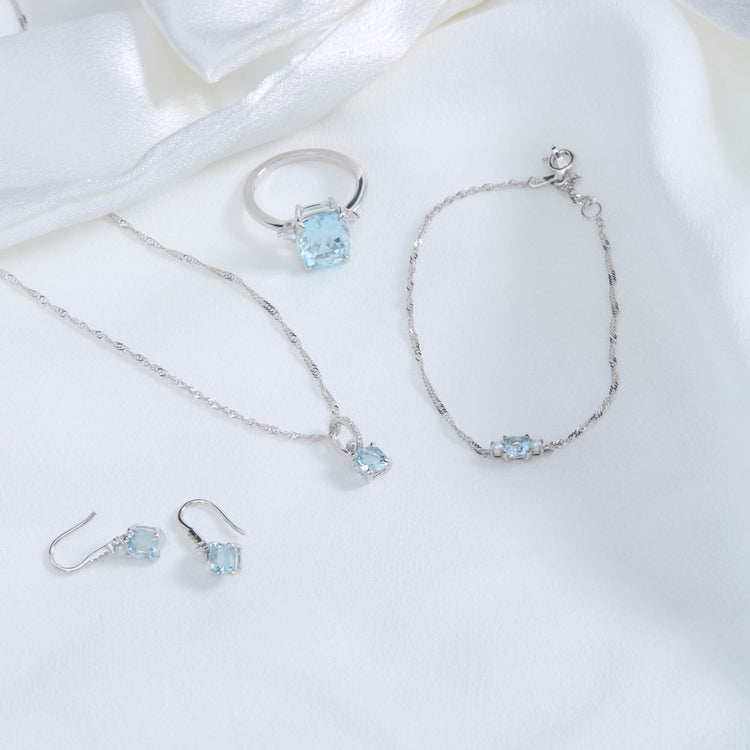 Still life image of Delicate Aquamarine Cushion Bracelet with Stone and Strand solid gold jewelry
