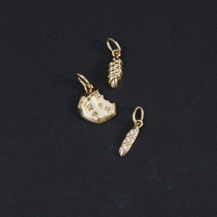 Still life image of Diamond Baguette Charm with Stone and Strand solid gold jewelry