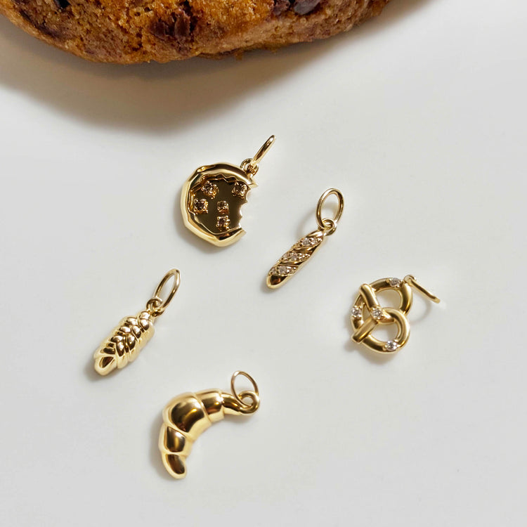 Still life image of Diamond Baguette Charm with Stone and Strand solid gold jewelry