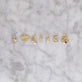 Still life image of Diamond Cookie Charm with Stone and Strand solid gold jewelry