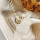 Still life image of Diamond Cookie Charm with Stone and Strand solid gold jewelry