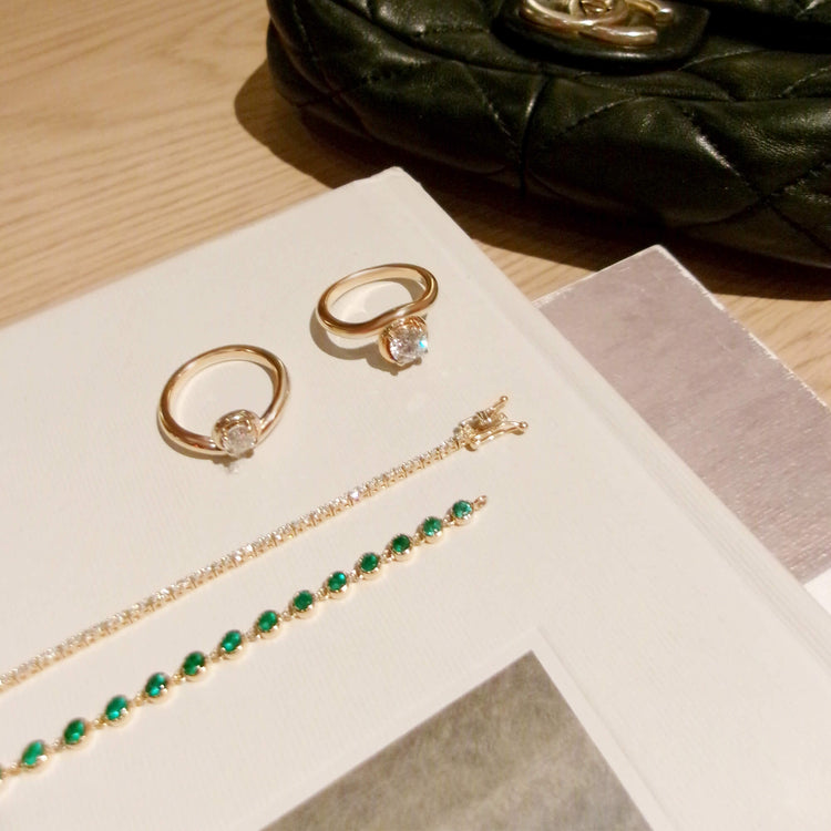 Still life image of Emerald Luxe Bezel Tennis Bracelet with Stone and Strand solid gold jewelry