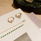 Still life image of Emerald Luxe Bezel Tennis Bracelet with Stone and Strand solid gold jewelry