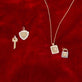 Still life image of Founding Member Diamond Crest Charm with Stone and Strand solid gold jewelry