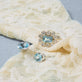 Still life image of Full Volume Le Bleu Vintage Flower Ring with Stone and Strand solid gold jewelry