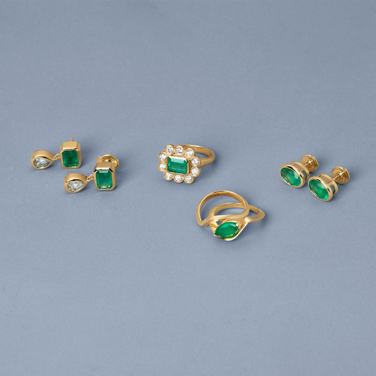 Still life image of Full Volume Marquise Emerald Luxe Ribbon Ring with Stone and Strand solid gold jewelry