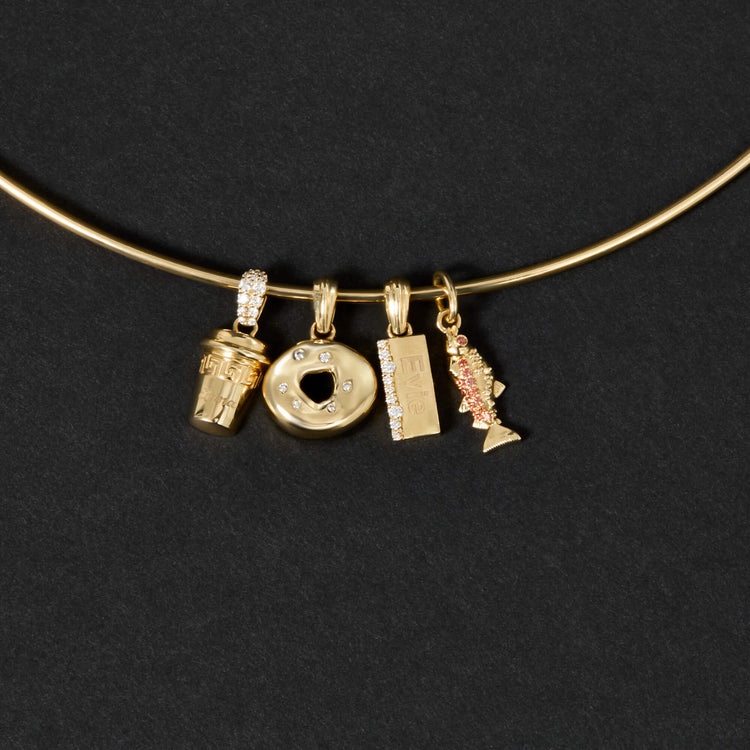 Still life image of Gold Bagel Brunch Charm with Stone and Strand solid gold jewelry