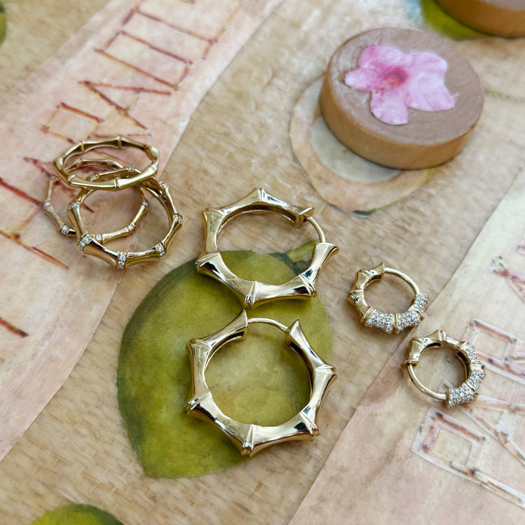 Still life image of Gold Bamboo Huggies with Stone and Strand solid gold jewelry
