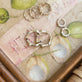 Still life image of Gold Bamboo Huggies with Stone and Strand solid gold jewelry