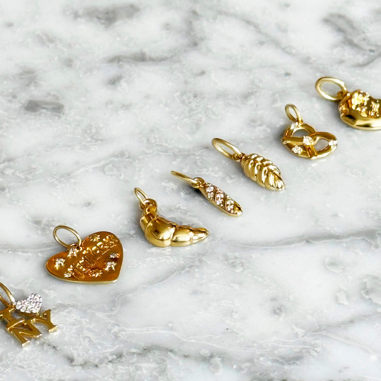 Still life image of Gold Challah Charm with Stone and Strand solid gold 