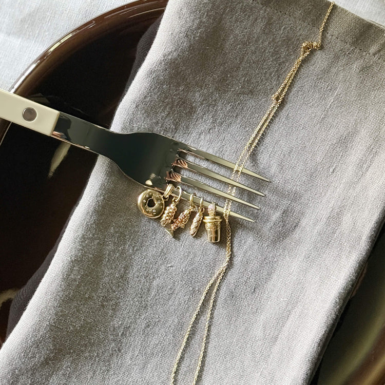 Still life image of Gold Challah Charm with Stone and Strand solid gold 