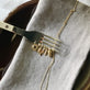 Still life image of Gold Challah Charm with Stone and Strand solid gold 