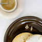 Still life image of Gold Coffee Brunch Charm with Stone and Strand solid gold jewelry