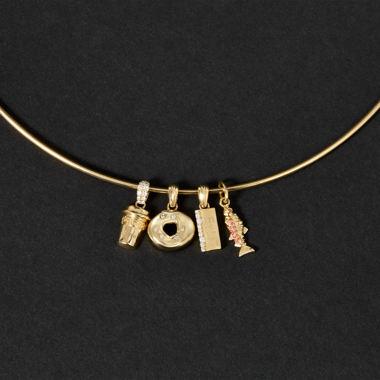 Still life image of Gold Coffee Brunch Charm with Stone and Strand solid gold jewelry