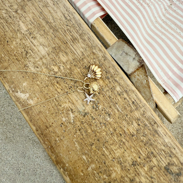 Still life image of LAB-Created Diamond Starfish Necklace with Stone and Strand solid gold jewelry