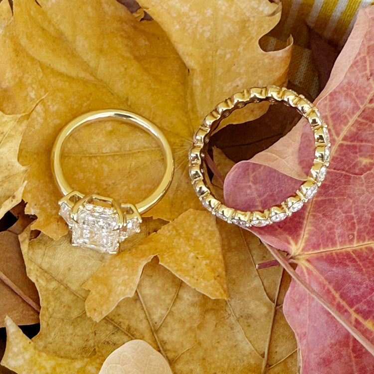 Still life image of LAB-Created Shared Prong Eternity Band with Stone and Strand solid gold jewelry